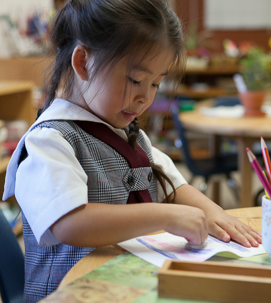 Children learning in a Montessori classroom at Casa dei Bambini